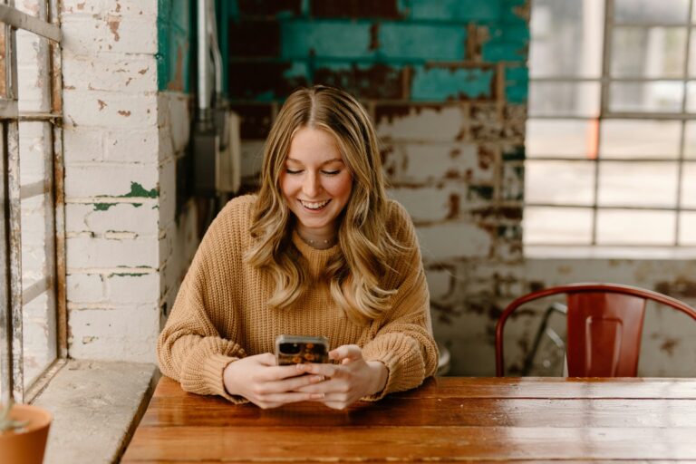 Good Customer Care Should Continue Well Past the Point of Loan Approval Borrower checking a loan account on a smartphone: Good Customer Care Should Continue Well Past the Point of Loan Approval